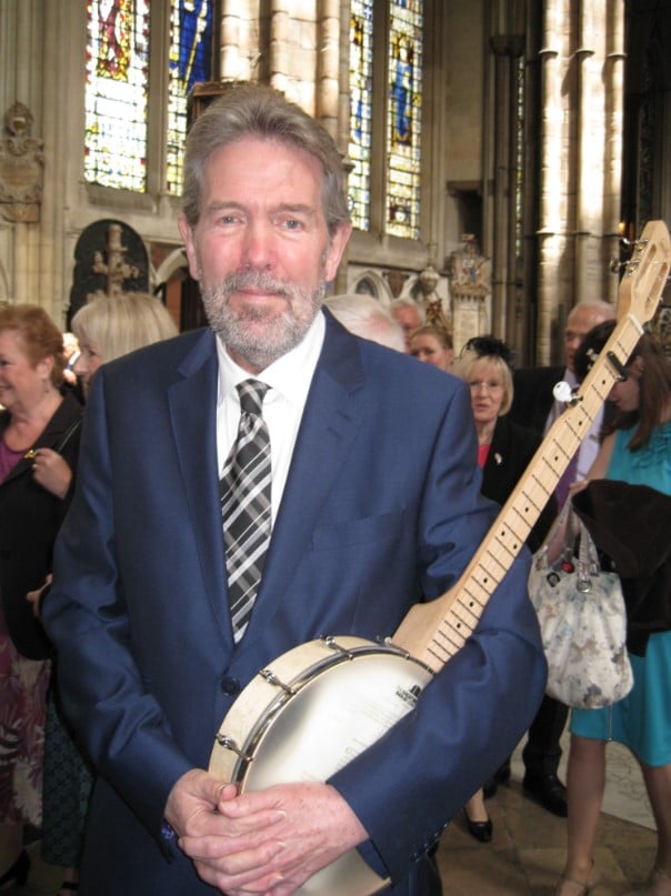 Mike King poses with the 1st banjo ever played in Westminster Abbey
