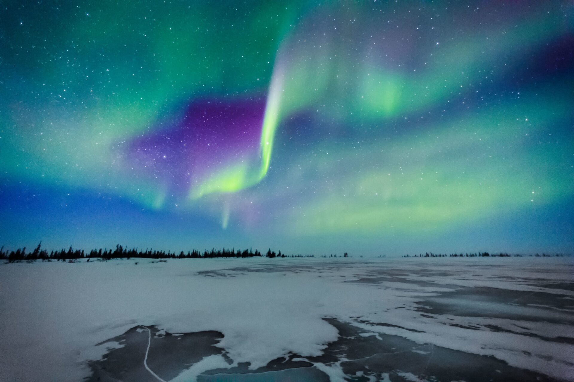 Northern Lights display over a frozen lake in northern Canada